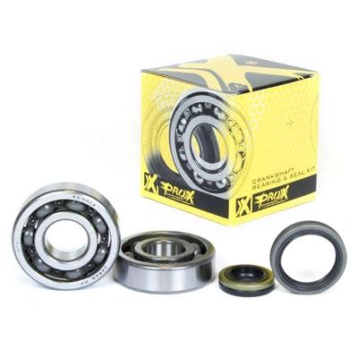 ProX Crankshaft bearing and seal kit RM125 99-11 four-piece set with bearings and seals beside yellow ProX box