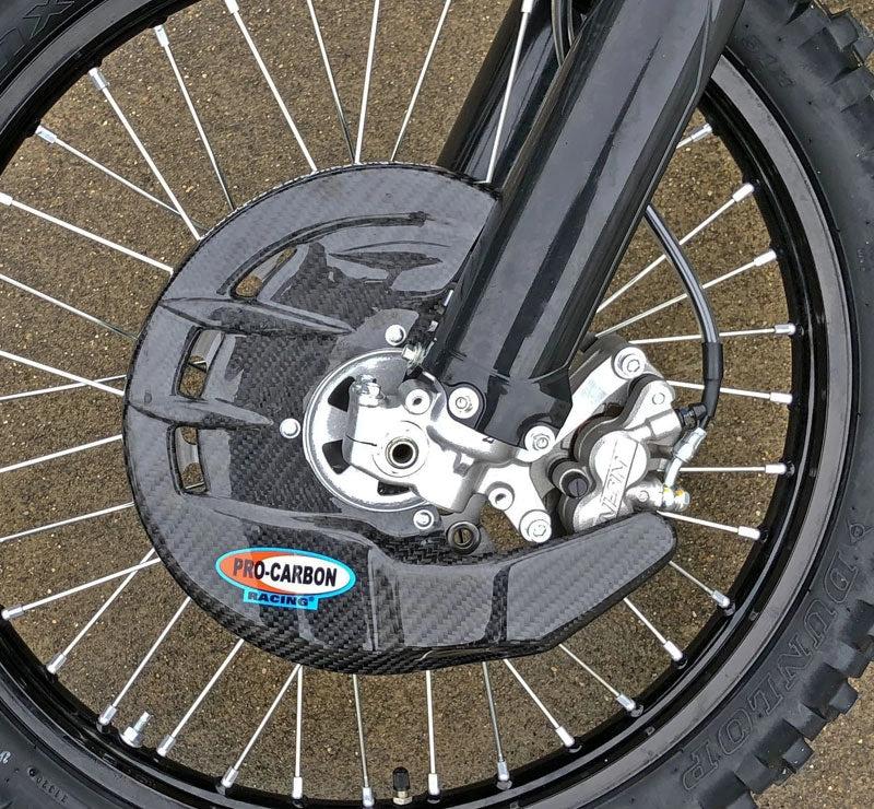 Pro Carbon Bremscheibenschutz (mit Montagesatz) für Honda CR/CRF 125/250/450 2004 - 2022 - MxProStoreParts