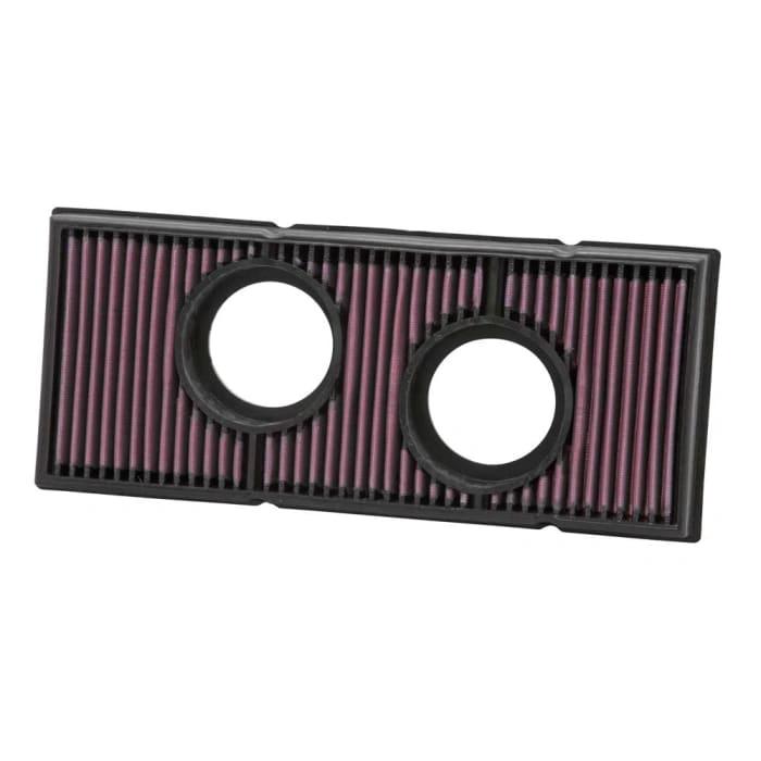 K&N air filter, 990 Adventure rectangular filter with purple pleated media and two round inlet openings.