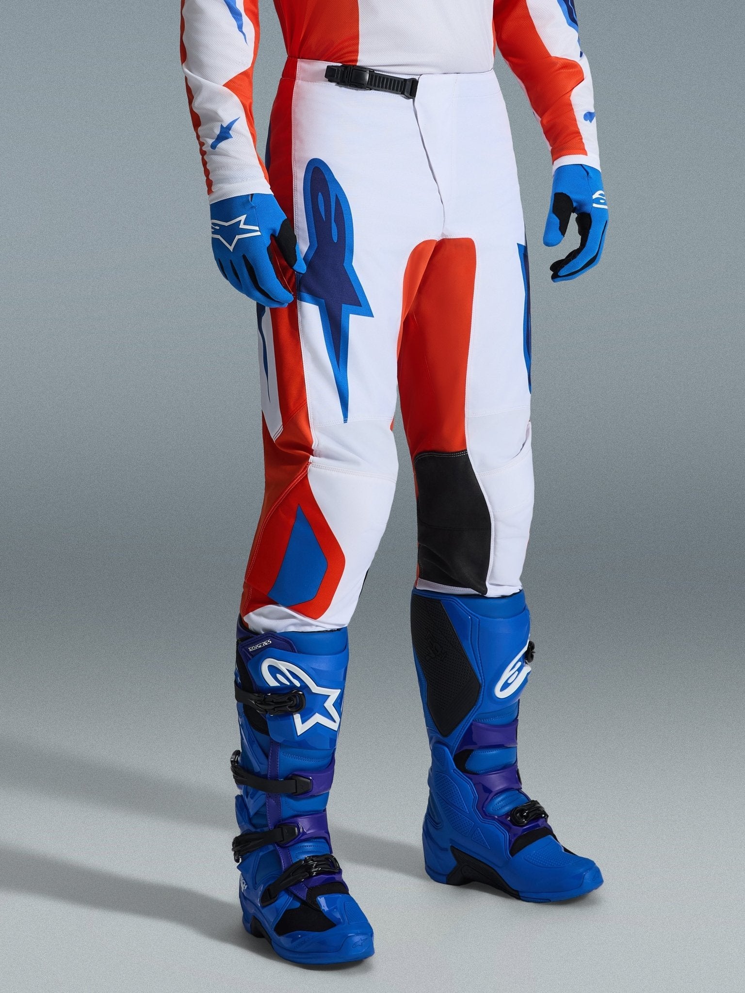 Alpinestars Fluid Grid ergonomische Motocross-Hose in Orange und UCLA Blau - MxProStoreParts