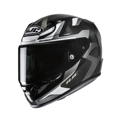 HJC RPHA 12 Carbon Xentra full-face helmet in black, white and gray with carbon fiber pattern and visor.