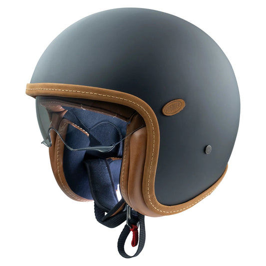 Premier Vintage Platinum ED helmet; matte blue-gray shell with brown leather trim and blue interior padding.